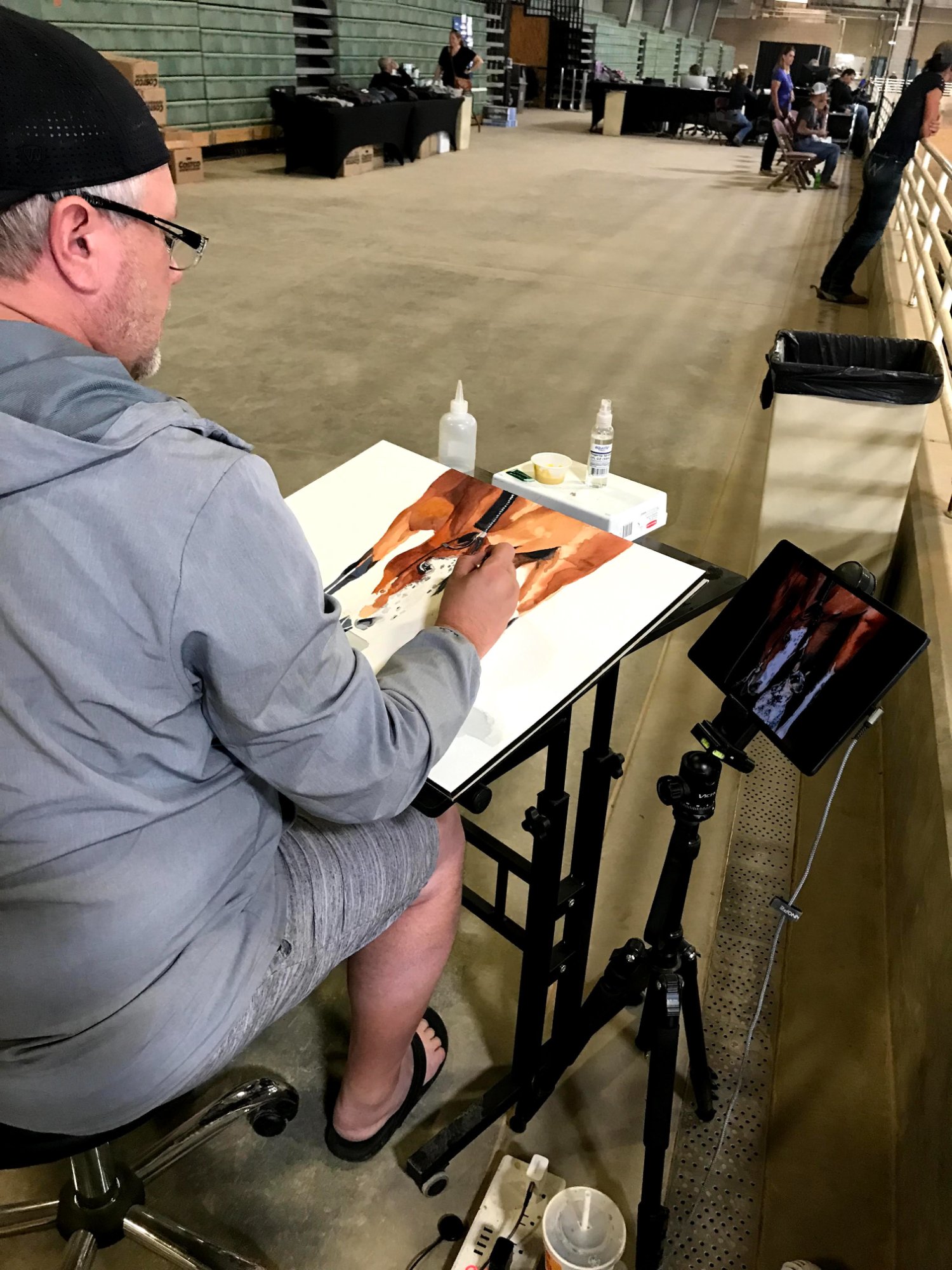 Brad Jones live painting at a horse competition